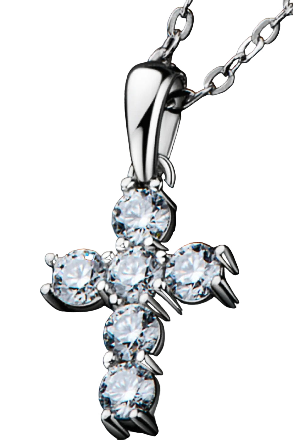 Moissanite cross pendant necklace in sterling silver, angled setting close-up on pure white