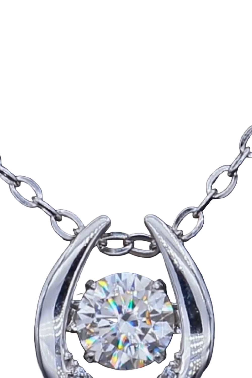Moissanite and zircon pendant necklace in silver, stone and chain close-up on pure white