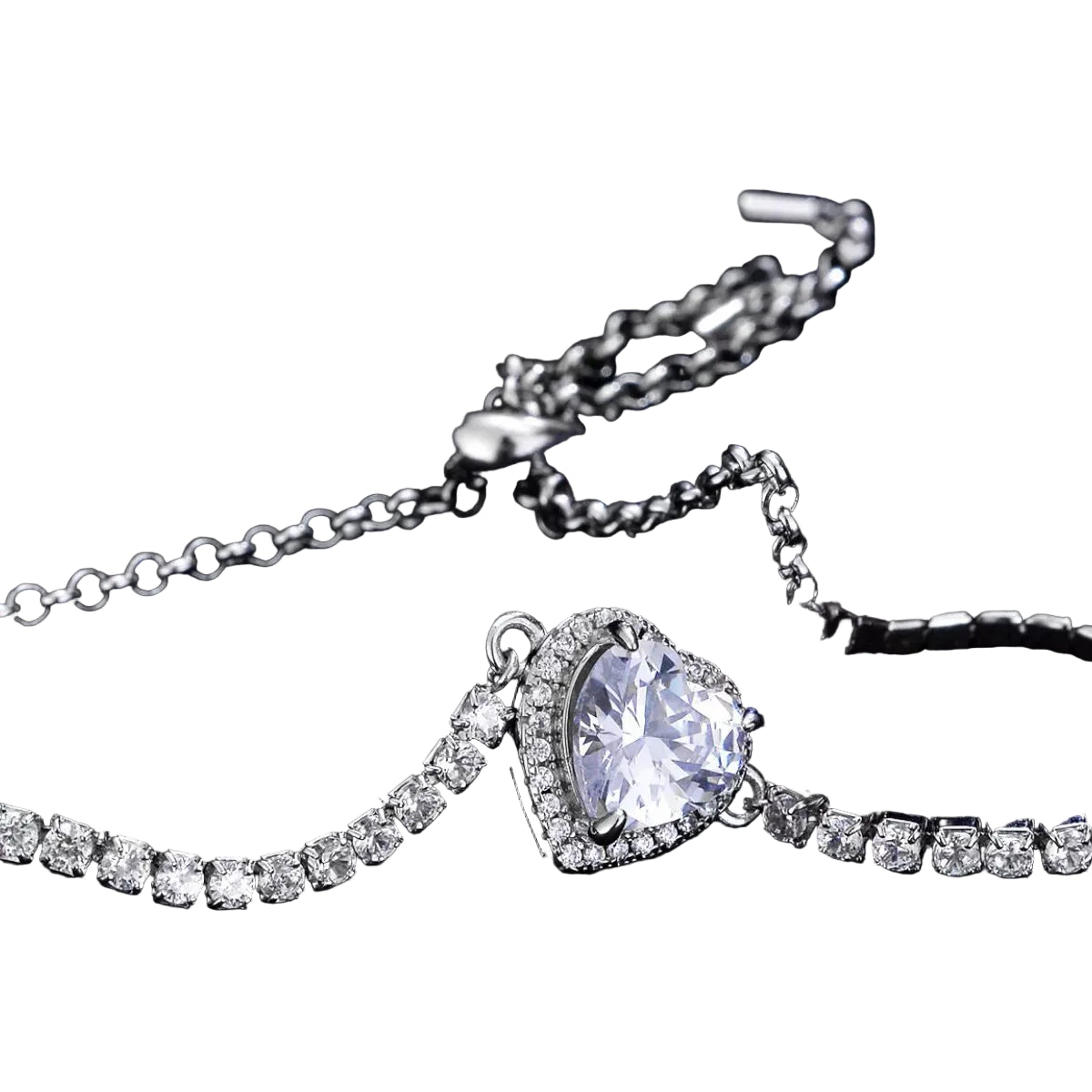 Moissanite heart chain bracelet in sterling silver, angled heart stone close-up on pure white