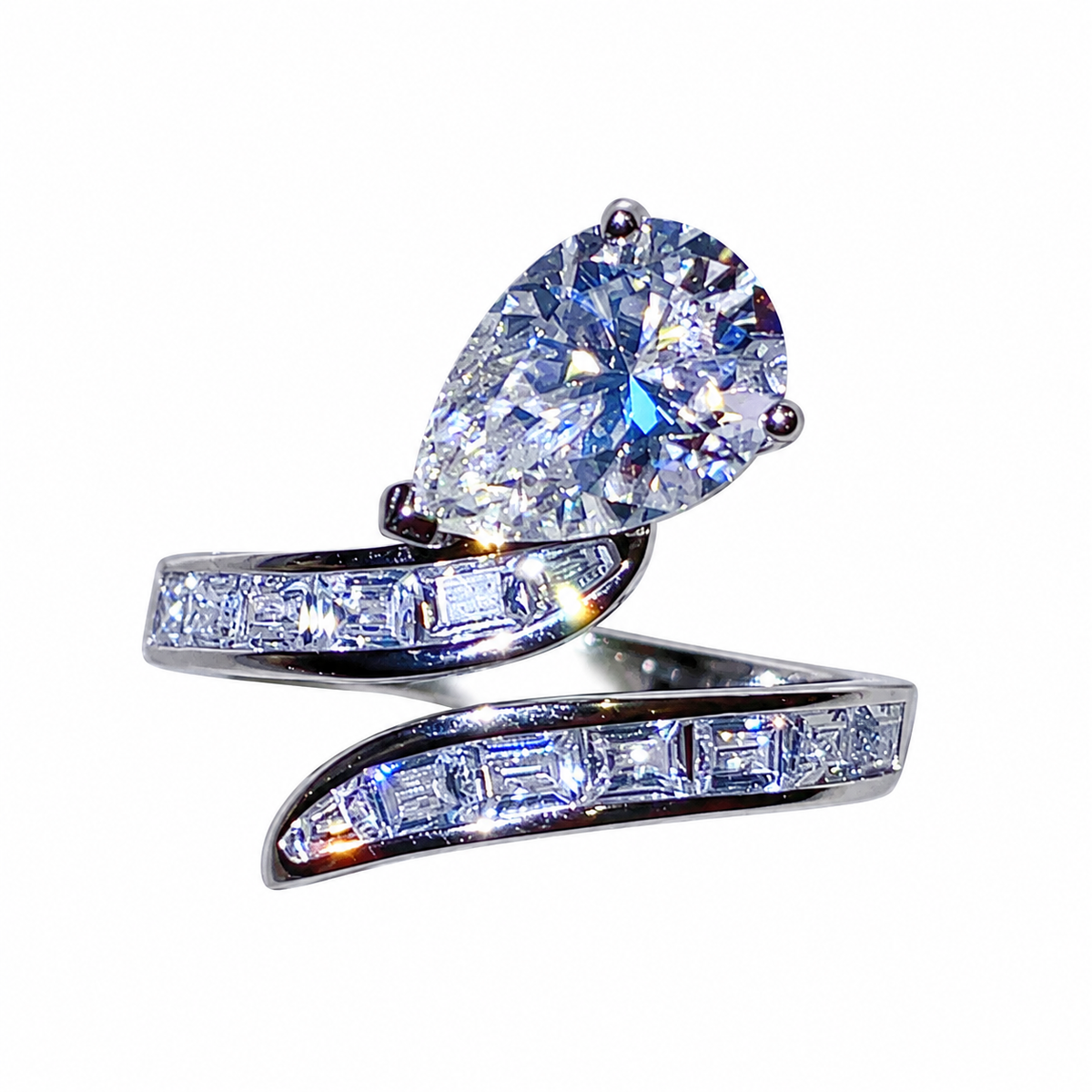 Pear-shaped moissanite and baguette zircon bypass ring in 925 sterling silver, front detail on white