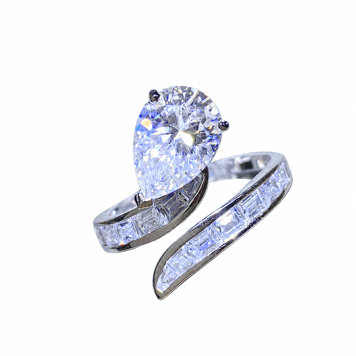 3 carat pear-cut moissanite silver bypass ring with zircon-set sweeping bands, angled view on white