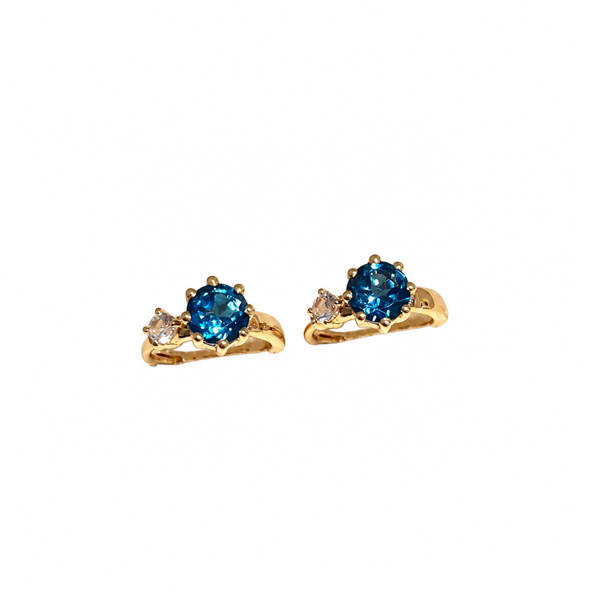 Blue and clear zircon hoop earrings in gold-plated sterling silver, front view on white